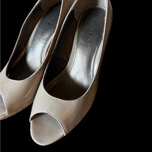 Light tan open toe pumps.